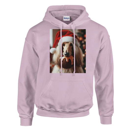 Pink hoodie with a dog wearing a Santa hat and holding a Christmas ornament on a green background