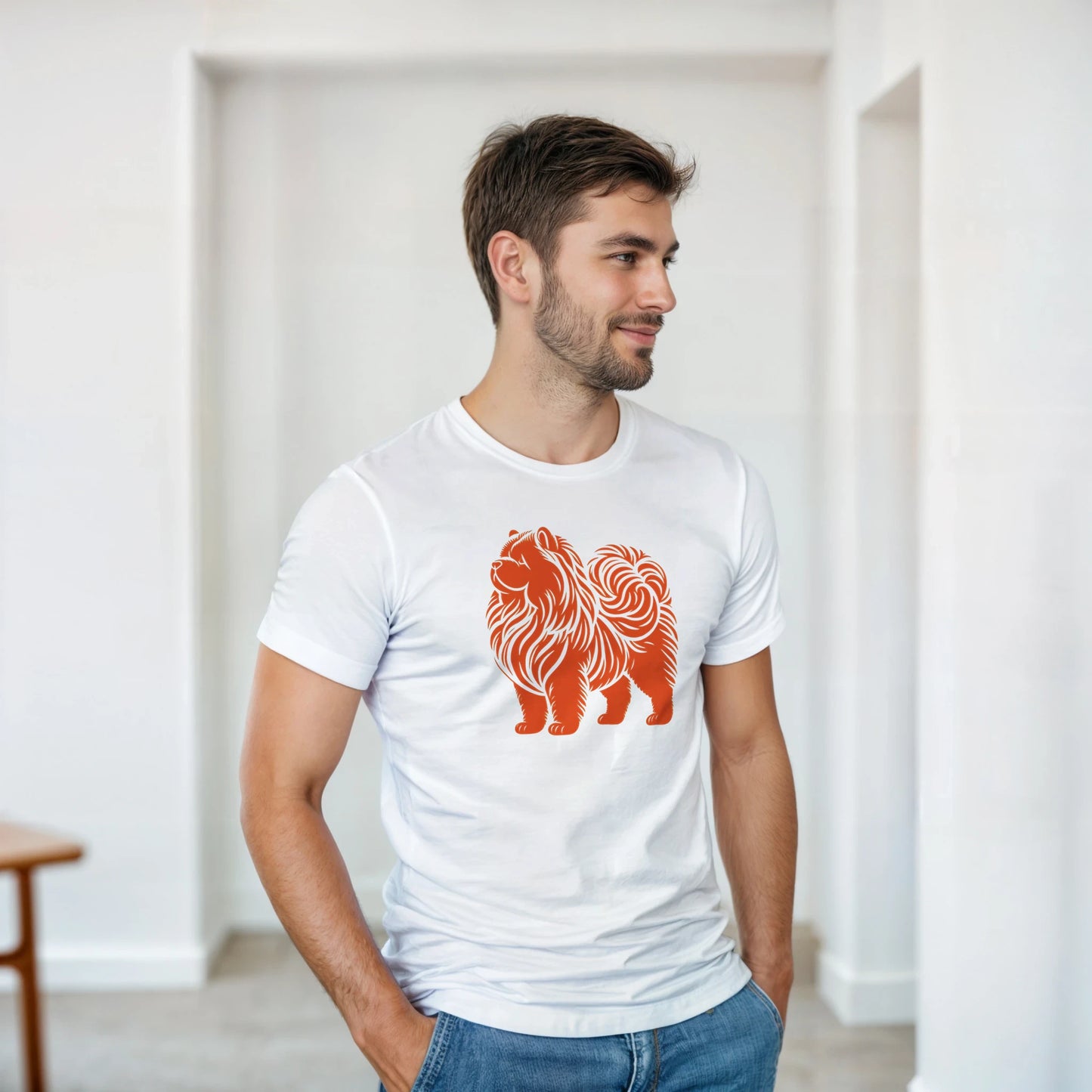 Man wearing a white t-shirt with an orange chow chow dog graphic in a minimal indoor setting