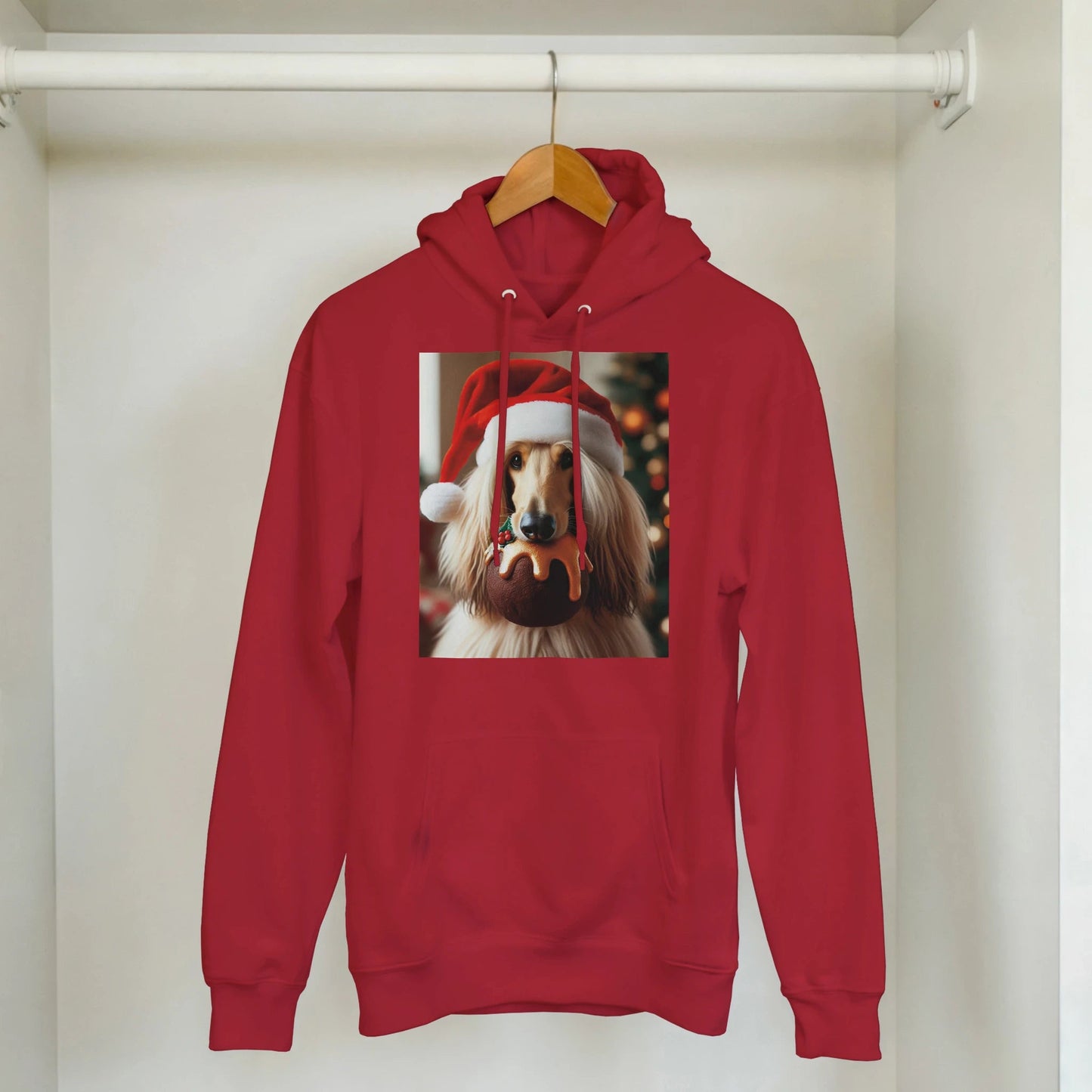 Red hoodie with a dog wearing a Santa hat on a hanger.